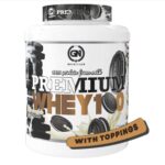 Premium Whey 2kg sabor Cookies & Chocolate GN Nutrition con proteína de suero y trozos de galleta.